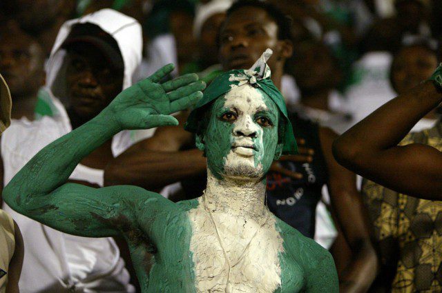 Fans cheer on the Nigerian team during their World Cup qualifier soccer match against Algeria in Ora..