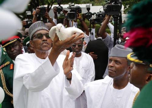 President Buhari releasing a dove during Nigeria independence celebration 