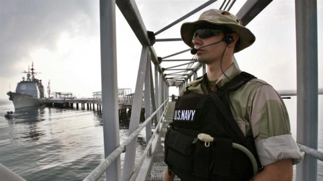 US Navy personnel guard the US military ship USS Vicksburg during the opening ceremony of a DP World managed oil terminal facility in Djibouti in 2006