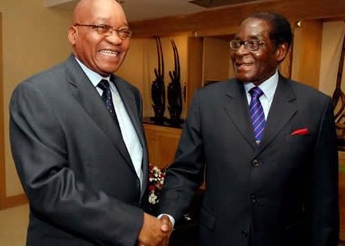 Zimbabwes President Robert Mugabe right and South Africas President Jacob Zuma left 1