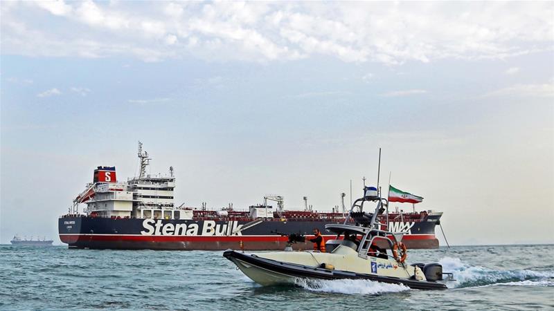A speedboat of the IRGC circles around a British flagged oil tanker Stena Impero which its forces seized