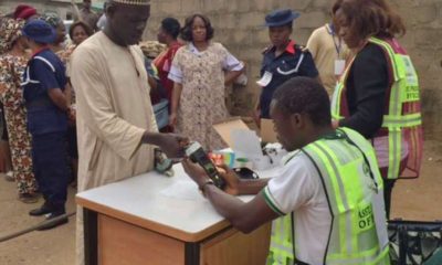 An INEC ad hoc staff accredits a voter at a polling unit. Photo used for illustrative purposes