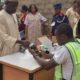 An INEC ad hoc staff accredits a voter at a polling unit. Photo used for illustrative purposes