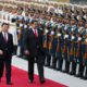 Chinese President Xi Jinping walks next to Venezuelas President Nicolas Maduro during his welcoming ceremony in Beijing