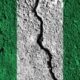 Nigeria flag with crack through the middle. Country divided concept