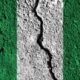 Nigeria flag with crack through the middle. Country divided concept