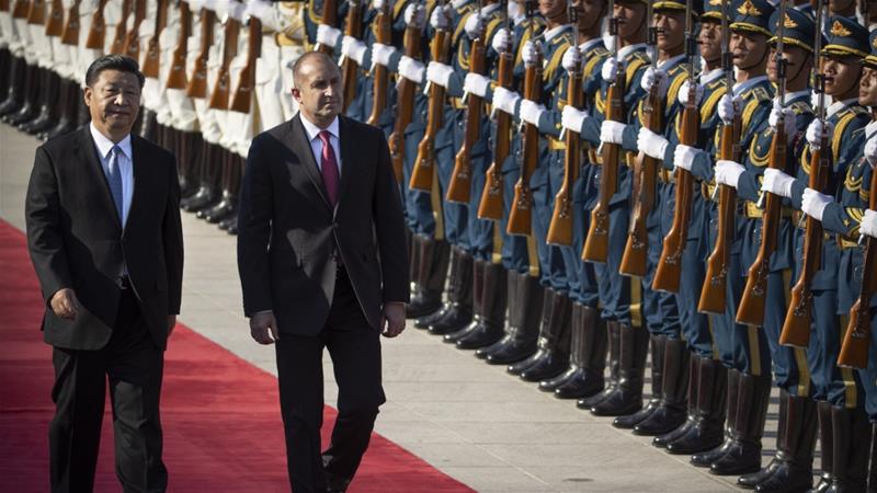 Chinas President Xi Jinping and Bulgarias President Rumen Radev review an honour guard during a welcome ceremony at the Great Hall of the People in Beijing