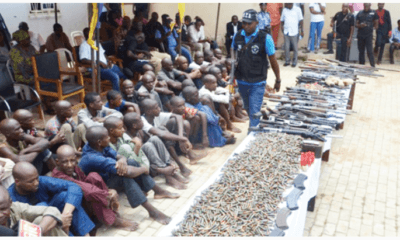 Suspected kidnappers armed robbers gun runners and dealers of illegal weapons from Libya and Chad being paraded by the Nigeria Police Force at the SARS office in Abuja