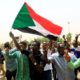 cropped Sudanese people chant slogans as they celebrate the signing of a constitutional declaration between TMC and FFC in Khartoum Sudan on