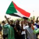 cropped Sudanese people chant slogans as they celebrate the signing of a constitutional declaration between TMC and FFC in Khartoum Sudan on