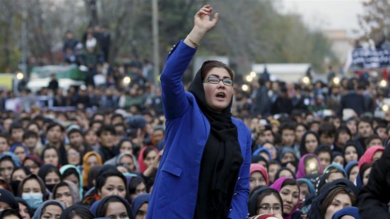 Women chat slogans during a protest against the killing of seven people from the Hazara community in Kabul Afghanistan