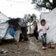 A girl at a makeshift camp for refugees and migrants beside the Moria camp on the island of Lesbos