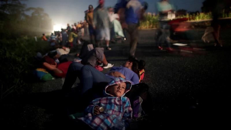 Migrants forming part of a caravan of thousands of people from Central America en route to the United States rest on the road in Mexico [File/Ueslei Marcelino/Reuters]