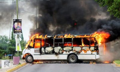 A burning bus is pictured during clashes between cartel gunmen and federal forces following the detention of Ovidio Guzman in Culiacan Sinaloa state Mexico