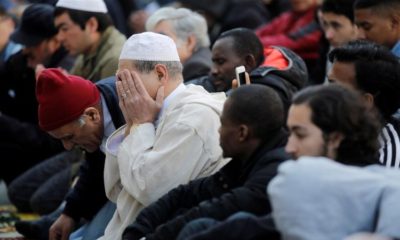 Muslims pray during Friday prayers in the street in front of the city hall of Clichy near Paris France