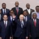President Vladimir Putin waves during a family photo with heads of countries taking part in the 2019 Russia Africa Summit in Sochi