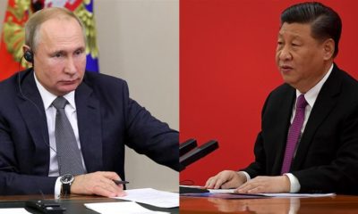 Chinas Chariman Xi Jinping and Russias President Vladimir Putin seen as they speak via video link during a joint press conference on December 2 2019