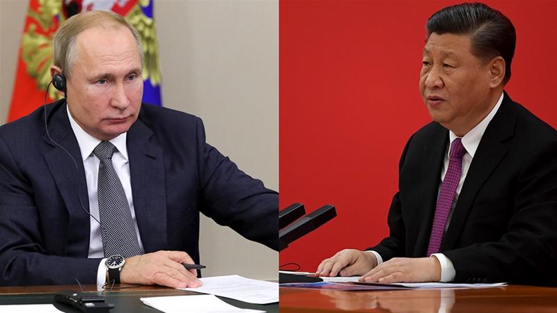 Chinas Chariman Xi Jinping and Russias President Vladimir Putin seen as they speak via video link during a joint press conference on December 2 2019