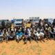 Irregular migrants wait to be transported after being arrested by Sudans paramilitary Rapid Support Forces RSF on the Khartoum State border Sudan