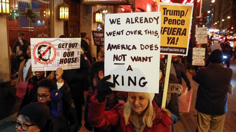 Protesters take part in a rally to support the impeachment and removal of US President Donald Trump in Chicago