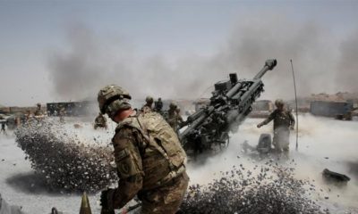 US army soldiers fire a howitzer artillery piece at Seprwan Ghar forward fire base in Panjwai district Kandahar province in southern Afghanistan on June 12 2011