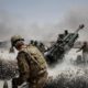 US army soldiers fire a howitzer artillery piece at Seprwan Ghar forward fire base in Panjwai district Kandahar province in southern Afghanistan on June 12 2011