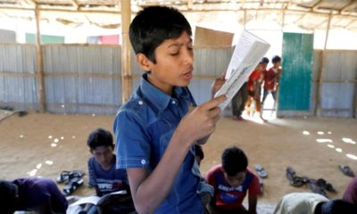 A child read a book in a make shift school run by Rohingya teachers in Kutupalong refugee camp in Cox’s Bazar Bangladesh February 7 2019