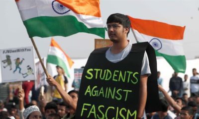 A man attends a protest against attacks on the students of New Delhis JNU on the outskirts of Mumbai on January 9 2020