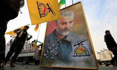 A picture of the Iranian General Qassem Soleimani is seen at the funeral of the Iraqi militia commander Abu Mahdi al Muhandis who was killed with him in Baghdad on January 3 1