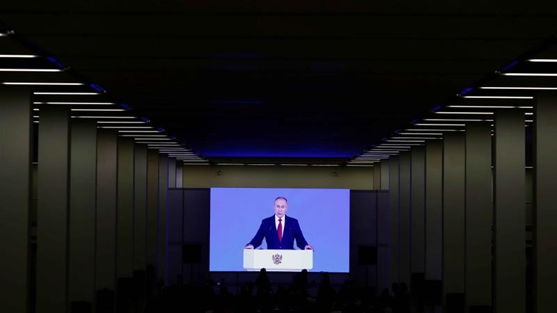 A screen at a shopping mall shows an image of President Vladimir Putin delivering his annual address to the Federal Assembly in Moscow on January 15 2020