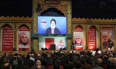 Lebanons Hezbollah leader Hassan Nasrallah addresses a funeral ceremony to mourn Iranian Major General Qassem Soleimani in Beiruts suburbs on January 5 2020