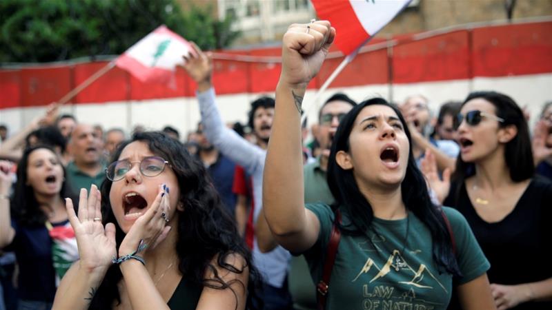 Protesters chant as as they demonstrate outside Lebanons Central Bank during ongoing anti government protests in Beirut Lebanon November 11 2019