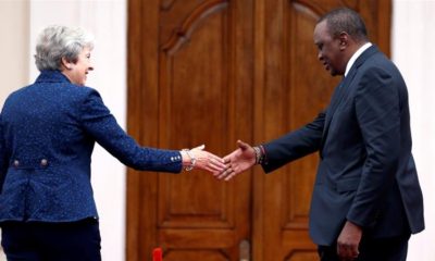 Then British Prime Minister Theresa May is greeted by Kenyas President Uhuru Kenyatta at the State House in Nairobi Kenya August 30 2018