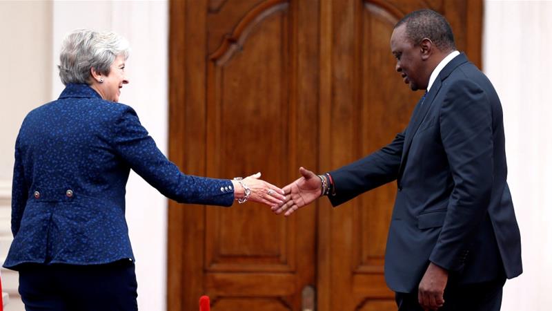 Then British Prime Minister Theresa May is greeted by Kenyas President Uhuru Kenyatta at the State House in Nairobi Kenya August 30 2018