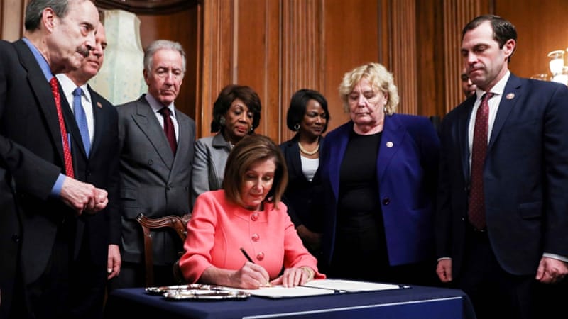 US House Speaker Nancy Pelosi signs the two articles of impeachment of US President Donald Trump before sending them over to the Senate on January 15 2020