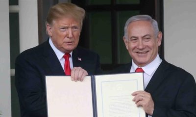 US President Donald Trump and Israels PM Benjamin Netanyahu hold up a proclamation recognising Israels sovereignty over the Golan Heights on March 25 2019