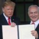 US President Donald Trump and Israels PM Benjamin Netanyahu hold up a proclamation recognising Israels sovereignty over the Golan Heights on March 25 2019
