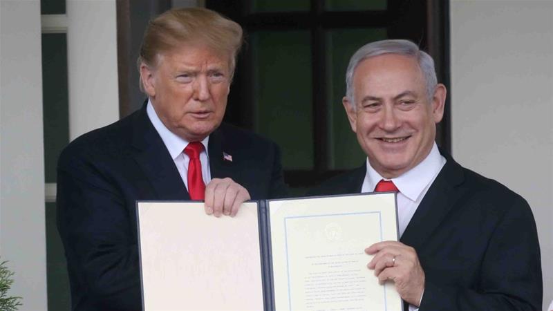 US President Donald Trump and Israels PM Benjamin Netanyahu hold up a proclamation recognising Israels sovereignty over the Golan Heights on March 25 2019