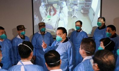 Chinese Premier Li Keqiang speaks to medical workers as he visits the Jinyintan hospital where patients who have coronavirus are being treated in Wuhan China