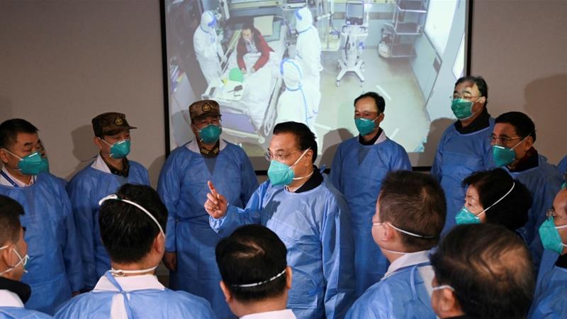 Chinese Premier Li Keqiang speaks to medical workers as he visits the Jinyintan hospital where patients who have coronavirus are being treated in Wuhan China