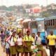 Pupils and other stranded commuters trekking at Ojota Long Bridge on Ikorodu Road Lagos