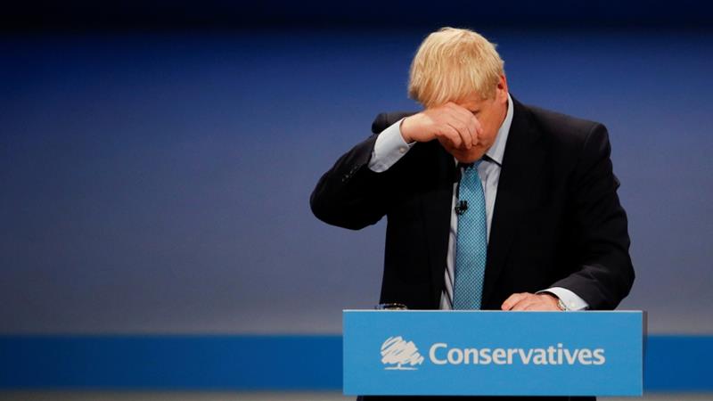 UK Prime Minister Boris Johnson reacts as he gives a closing speech at the Conservative Party annual conference in Manchester Britain October 2 2019