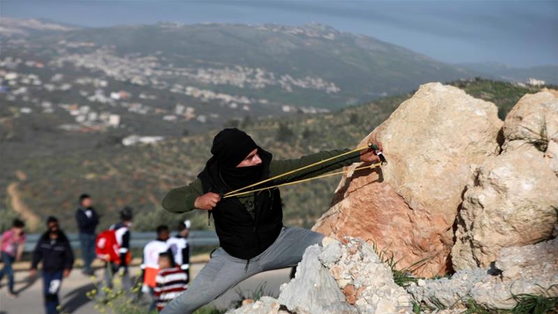 A Palestinians protest illegal Israeli settlements near the town of Beita in the Israeli occupied West Bank on March 11 2020