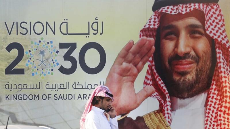 A banner advertises Saudi Crown Prince Mohammed bin Salmans Vision 2030 outside a mall in Jeddah Saudi Arabia on February 5 2020
