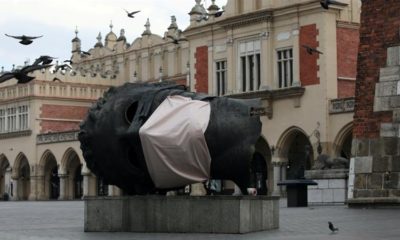 A sculpture Eros Bendato with a mock mask is seen on the main square during the coronavirus disease COVID 19 lockdown in Krakow Poland on March 23 2020