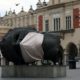 A sculpture Eros Bendato with a mock mask is seen on the main square during the coronavirus disease COVID 19 lockdown in Krakow Poland on March 23 2020