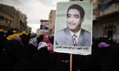 A woman holds a poster of Yemens late President Ibrahim al Hamdi during a protest demanding former President Salehs immunity be stripped in Sanaa March 28 2013