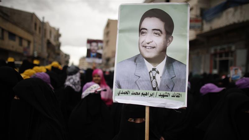 A woman holds a poster of Yemens late President Ibrahim al Hamdi during a protest demanding former President Salehs immunity be stripped in Sanaa March 28 2013