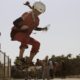 An Afghan girl jumps on her skateboard in Kabul on June 21 2012 hundreds of Afghan boys and girls celebrated World Skateboarding Day in the national capital