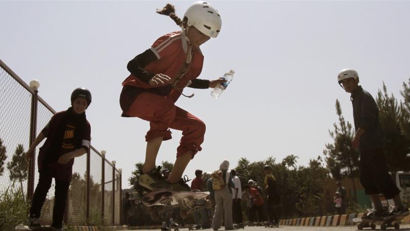 An Afghan girl jumps on her skateboard in Kabul on June 21 2012 hundreds of Afghan boys and girls celebrated World Skateboarding Day in the national capital